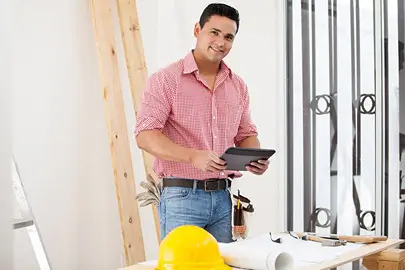 installer standing with tablet